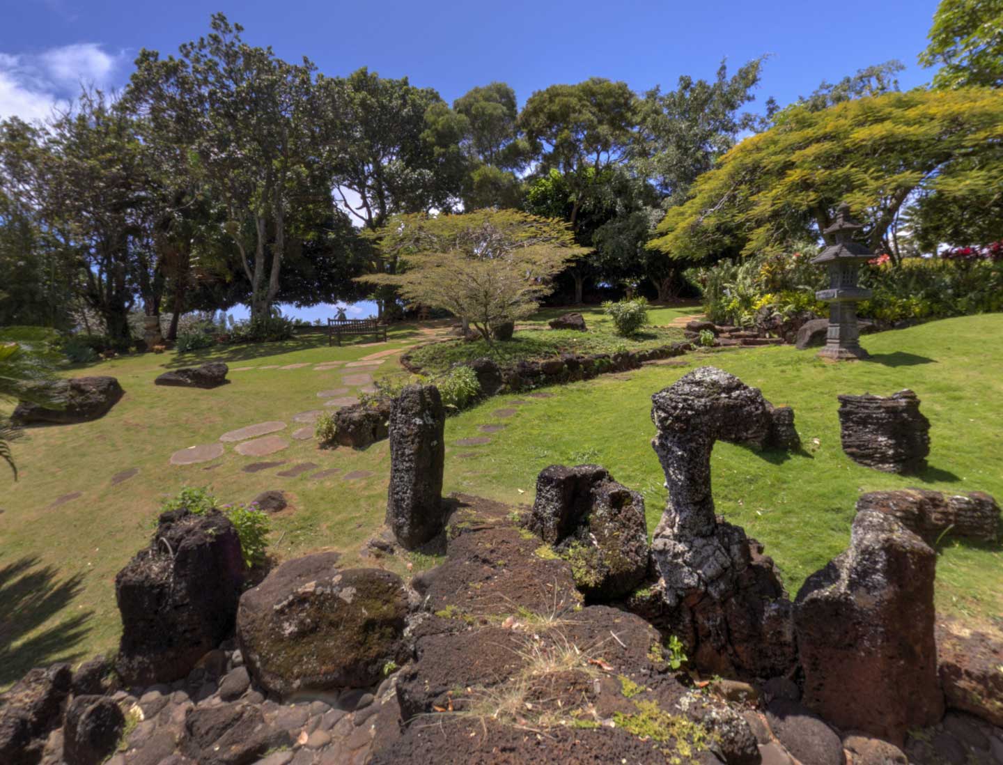 Scenic stone path and tropical landscaping at Kukuiolono Japanese Garden, a serene wedding venue on Kauai’s South Shore with Pastor Kilborn.